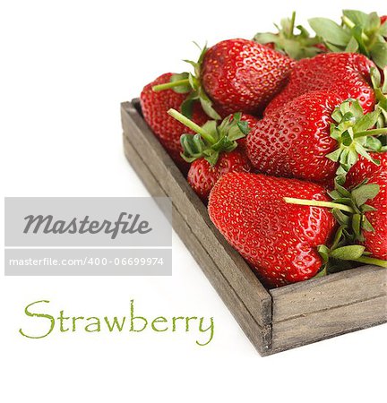 Sweet ripe strawberries in a wooden box on a white.