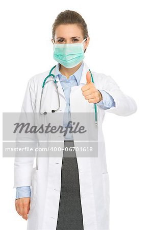 Medical doctor woman in mask showing thumbs up