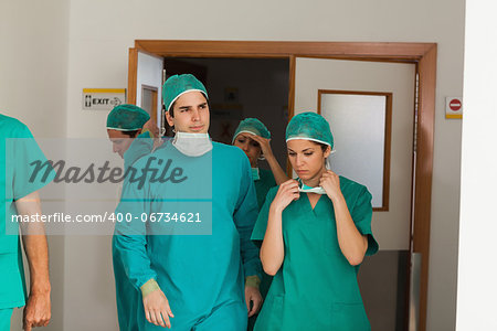 Surgery team leaving the operating room in hospital