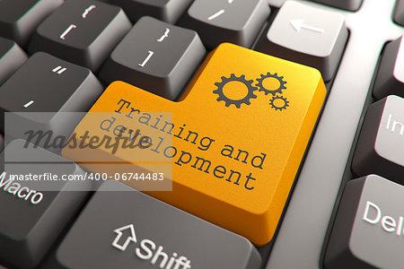 Training and Development, Orange Button on Computer Keyboard. Internet Concept.