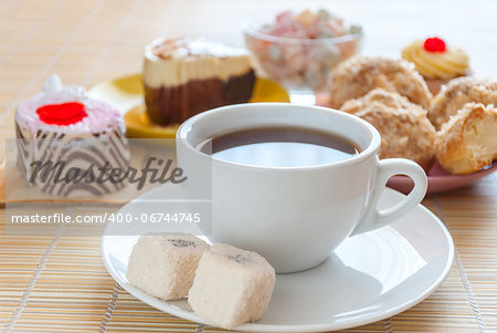 Tea, fresh cherry muffin, colorful delight, eclair and doughnut, various sweet dessert, close up