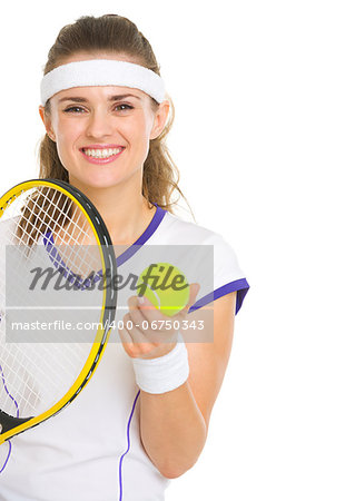 Smiling female tennis player with racket and ball