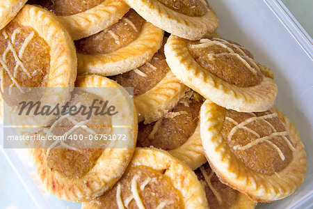 Pineapple Tart Pastry Stacked Up in Plastic Container Closeup