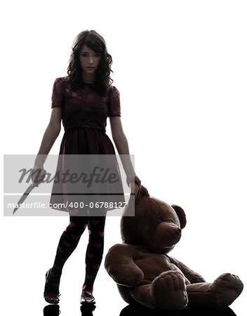 one caucasian strange young woman killer holding  bloody knife an teddy bear in silhouette white background