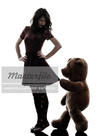one caucasian strange young woman and vicious teddy bear  in silhouette white background