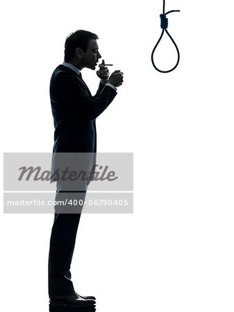 one caucasian man smoking cigarette  standing in front of hangman's noose in silhouette studio isolated on white background