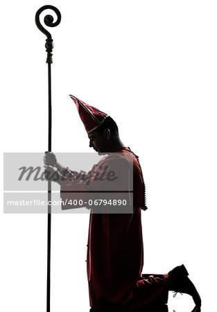 one man cardinal bishop silhouette in studio isolated on white background