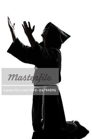 one caucasian man priest praying silhouette in studio isolated on white background