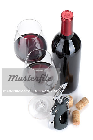 Red wine, corks and corkscrew. Isolated on white background, view from above, focus on glasses.