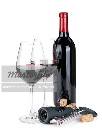 Red wine, corks and corkscrew. Isolated on white background