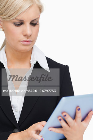 Businesswoman holding a tablet against white background