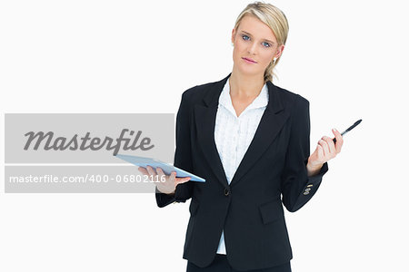 Businesswoman holding tablet and pen