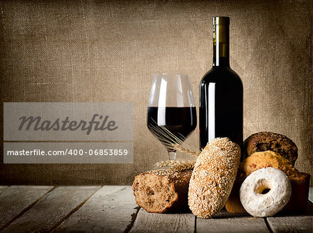 Wine and assortment of bread on the wooden table