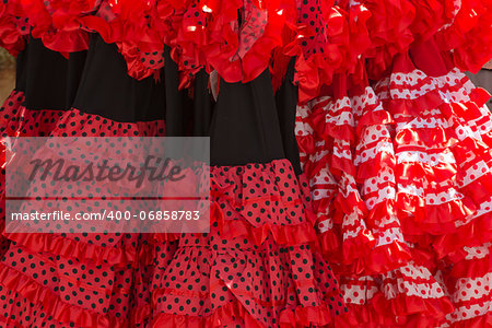 Flamenco dresses in a shop in the neighborhood of Santa Cruz, Seville, Spain.
