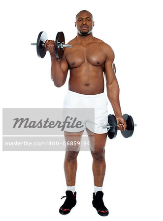 Muscular man exercising with dumbbells isolated against white background