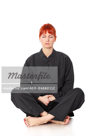girl in black kimono siting and meditation isolated on white