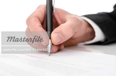 Business man signing a contract. Shallow depth of field.