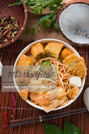 asam laksa noodle ,Penang style with raw ingredients on background