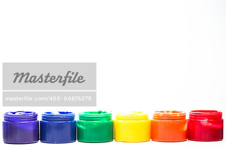 Rainbow paint pots in a row for gay pride on white background