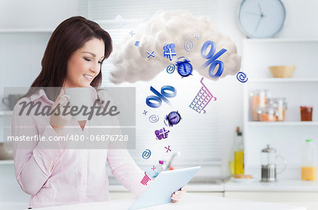 Woman using applications from tablet and connecting to cloud computing in the kitchen at home