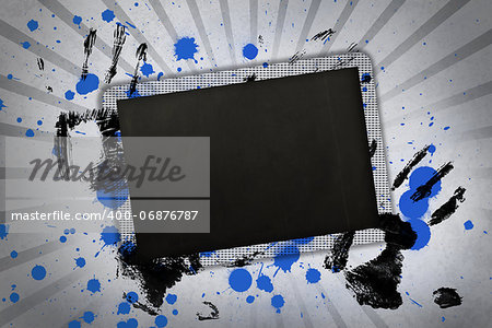 Black copy space with black hand prints and blue paint splashes