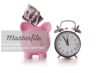 Alarm clock and piggy bank with dollar sticking out on white background