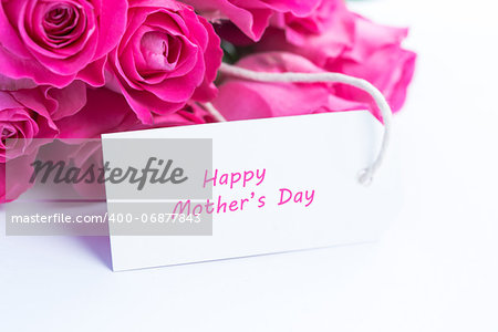 Close up of a beautiful bouquet of roses with a happy mothers day card
