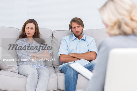 Young couple going through therapy and listening to the therapist