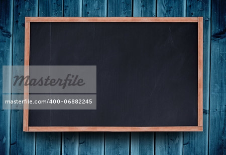 Blackboard with copy space on blue wooden board background