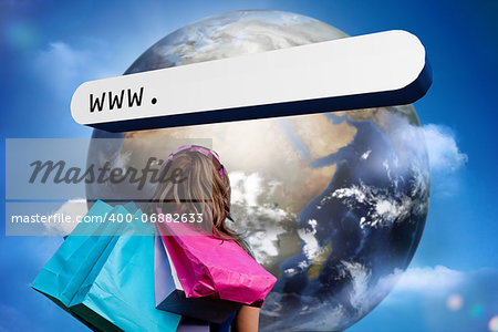 Girl with shopping bags looking at address bar with large earth in blue sky with clouds