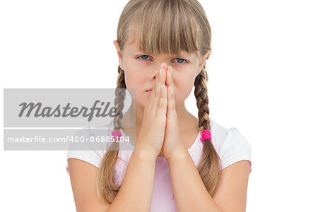 Little girl with her hands on her face on white background
