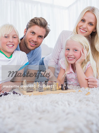 Family playing chess in the living room