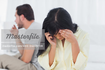 Woman calling and crying during dispute in bedroom