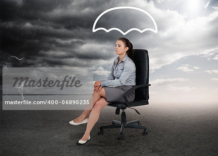 Umbrella graphic above the head of a businesswoman in stormy weather setting