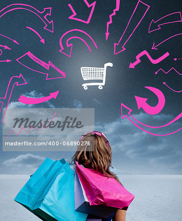 Woman holding shopping bags and looking at a drawing of a shopping cart with pink arrows