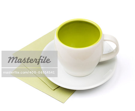 Empty cup on green placemat. Isolated on white background