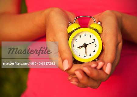 Close-up Photo of Woman Hands with Alarm Clock