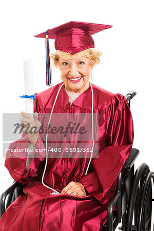 Sweet senior lady in wheelchair, proudly holding up her diploma.  White background