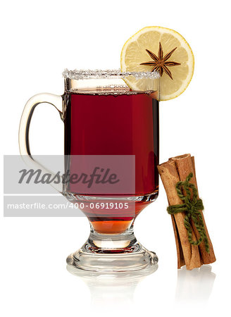 Hot mulled wine with lemon, anise and cinnamon. Isolated on white