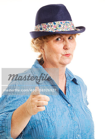 Portrait of a mature woman pointing at the camera.  Isolated on white.