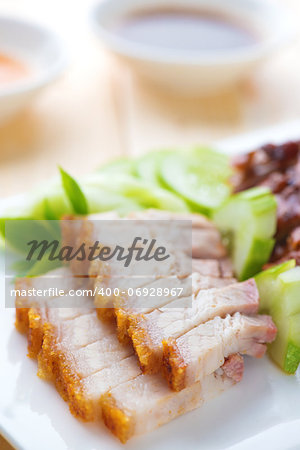 Siu Yuk or crispy roasted belly pork Chinese style and roast duck, served with steamed rice. Malaysia Chinese cuisines.