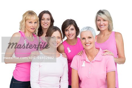 Happy women posing and wearing pink for breast cancer on white background