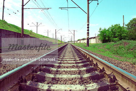railway tracks in a rural scene with nice pastel sunset