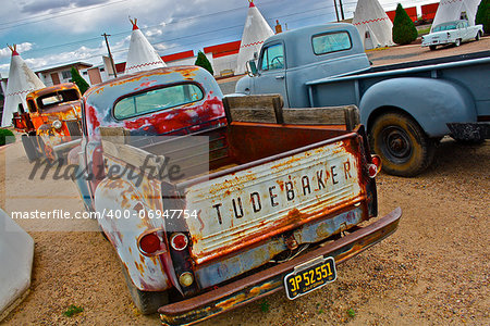 Classic old trucks standing together and showing past