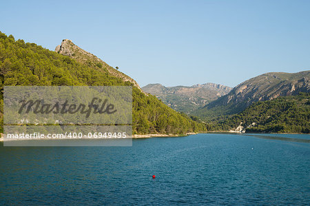 Guadalest reservoir on a sunny summer morning, Costa Blanca, Spain