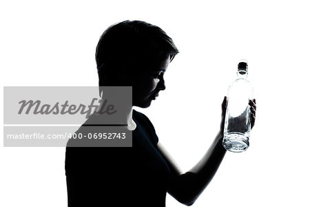 one caucasian young teenager silhouette boy or girl portrait holding empty vodka alcohol bottle in studio cut out isolated on white background