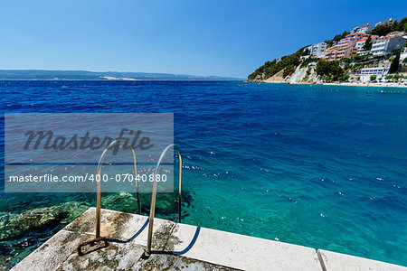 Metal Ladder on the Beach and Azure Mediterranean Sea near Split, Croatia
