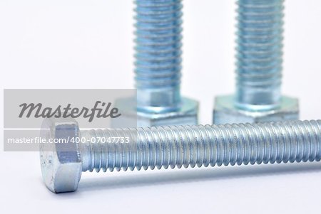 Three galvanized steel screw on a white background