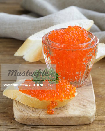 delicacy appetizer red caviar on a white baguette