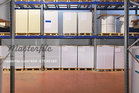 Pallets with printing paper in distrbution warehouse